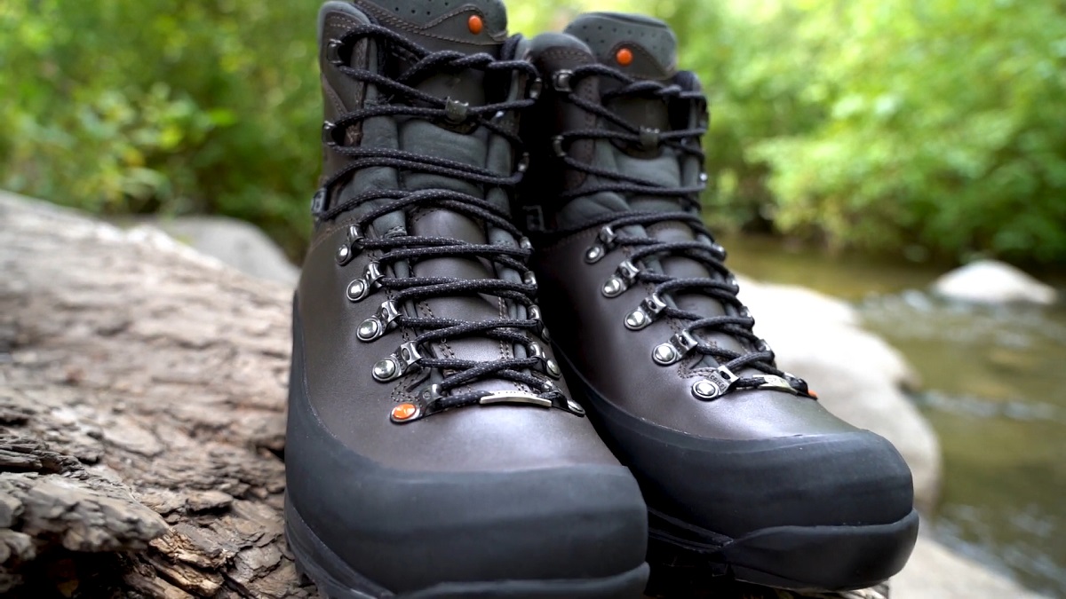 A pair of black, waterproof mountain boots with reinforced laces