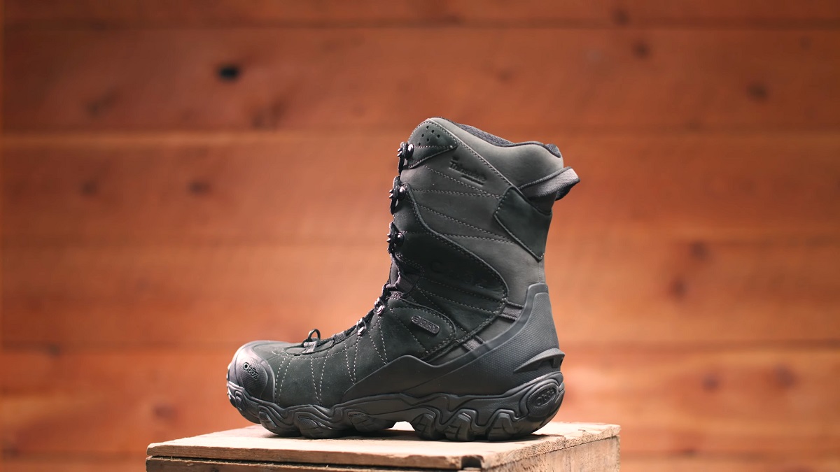 A black insulated winter hiking boot with a rugged tread